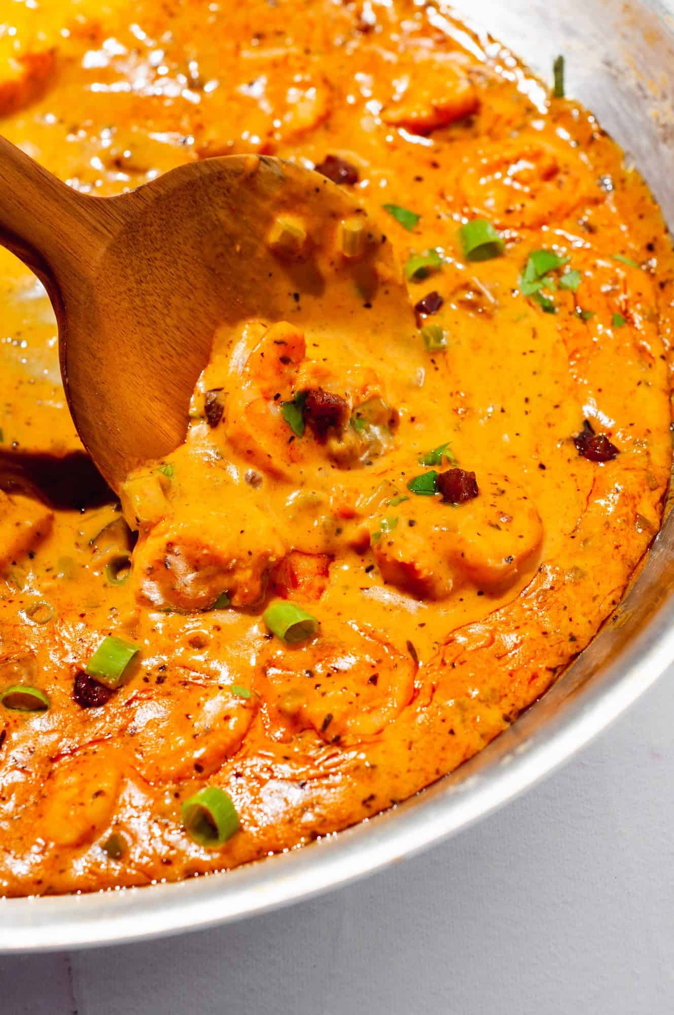 Close up of shrimp in Cajun cream sauce in a pan