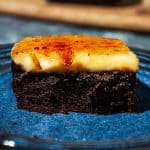 creme brulee brownie with caramelized sugar top on a blue speckled plate