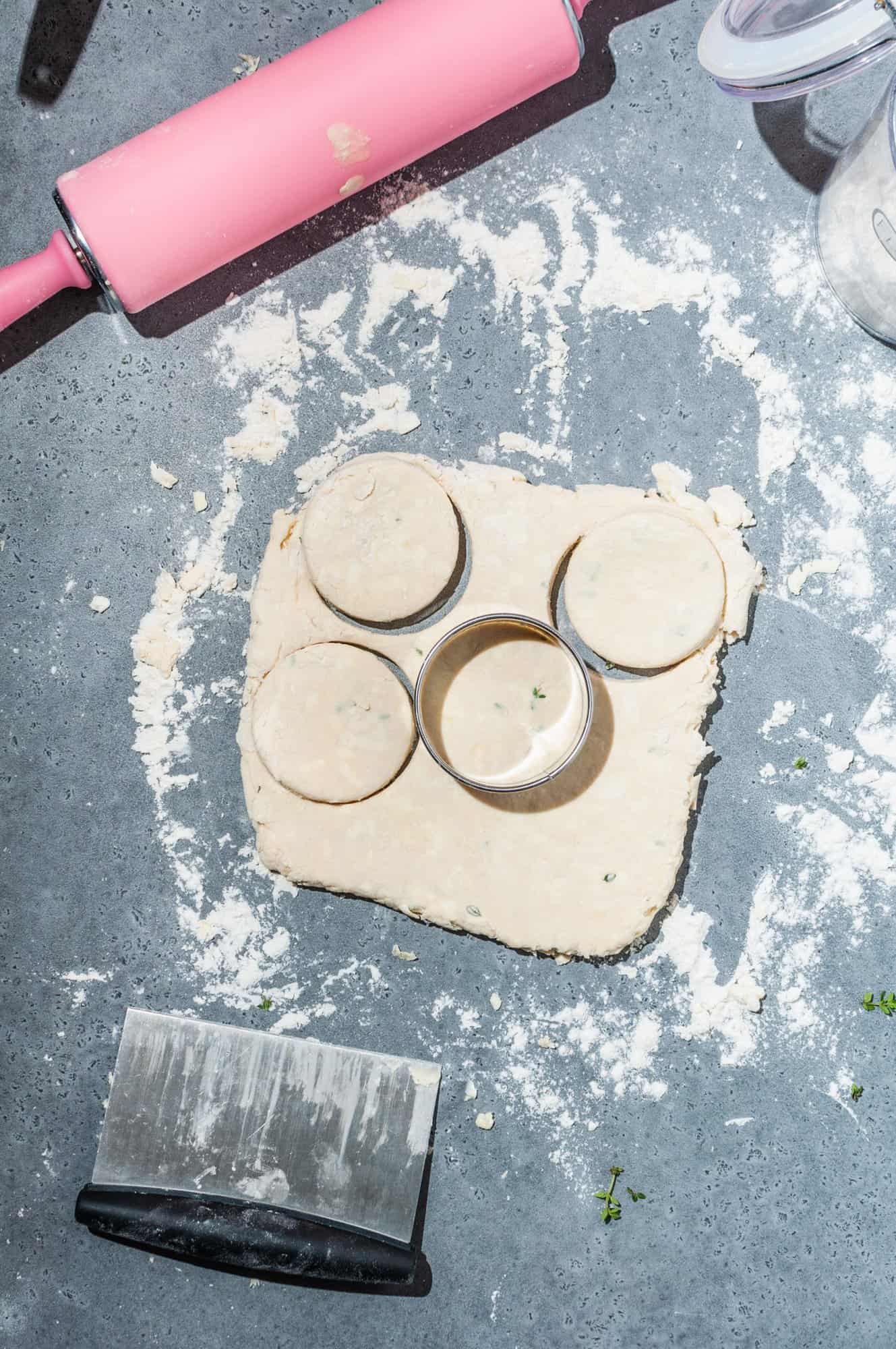 stamping out biscuits with a round cutter