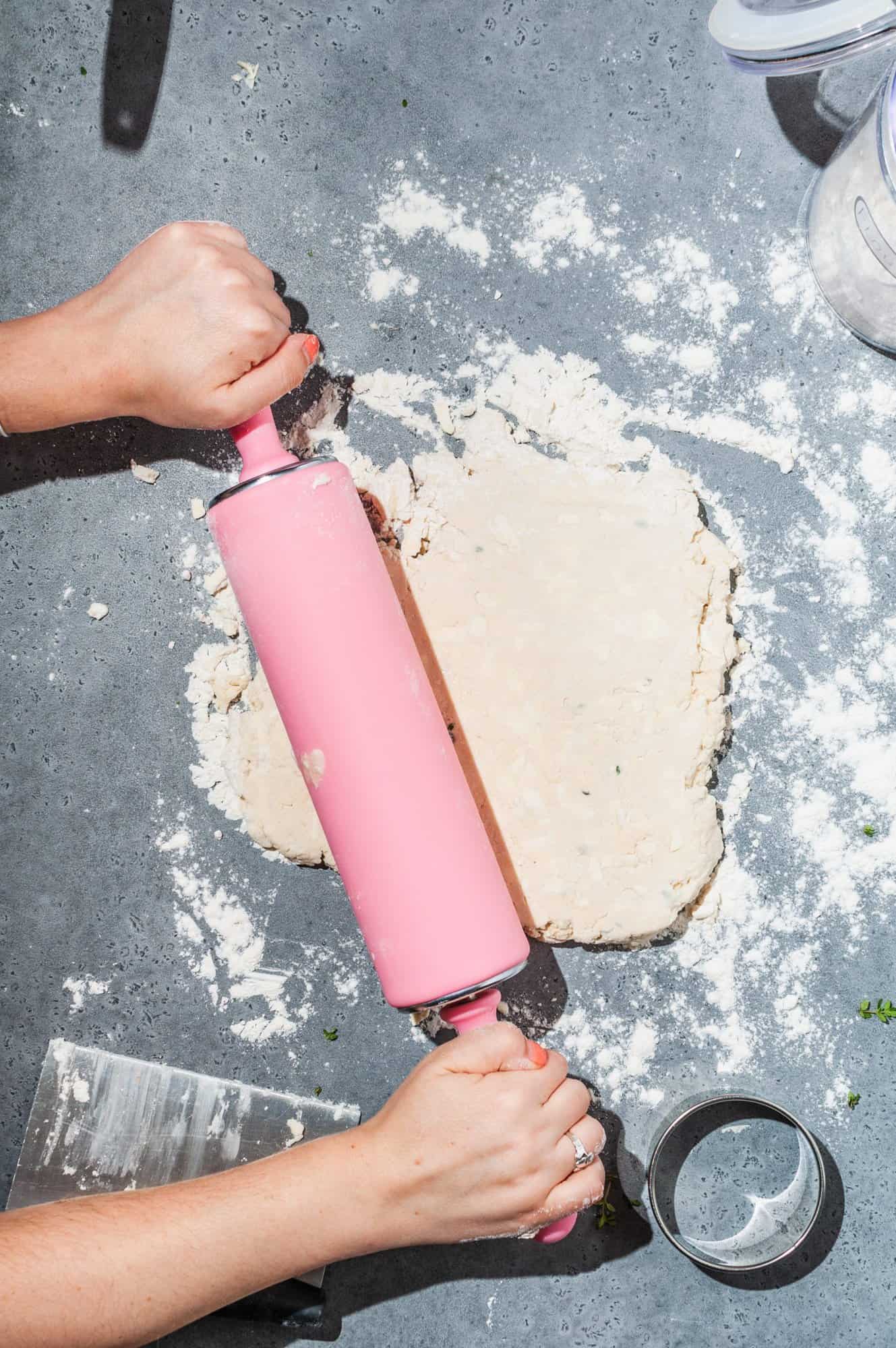 rolling out biscuit dough with a rolling pin