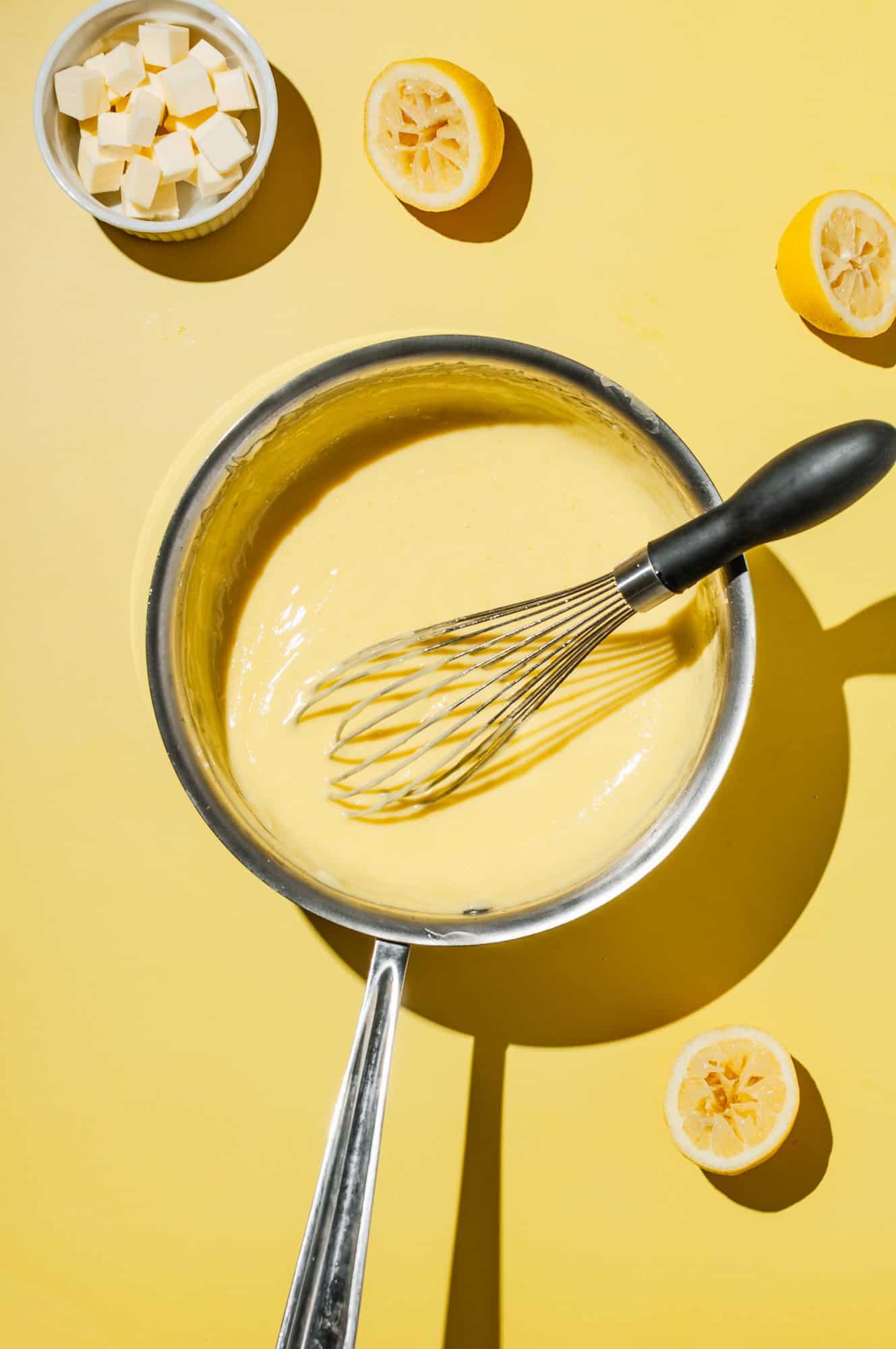 whisk in a saucepan filled with fresh lemon curd
