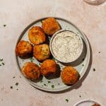 ham and cheese croquettes on a plate with side of aioli for dipping