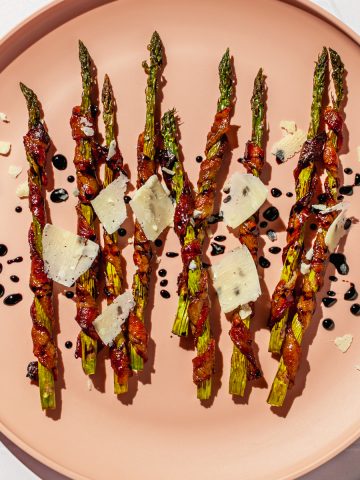 bacon-wrapped asparagus with Parmesan shavings and balsamic glaze drizzle