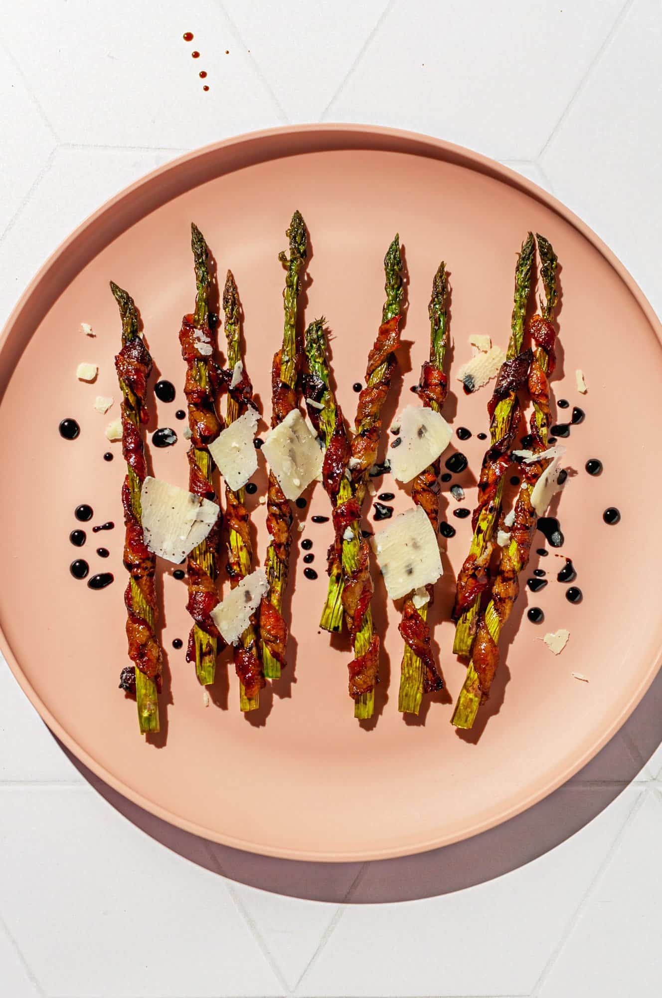 bacon-wrapped asparagus with Parmesan shavings and balsamic glaze drizzle