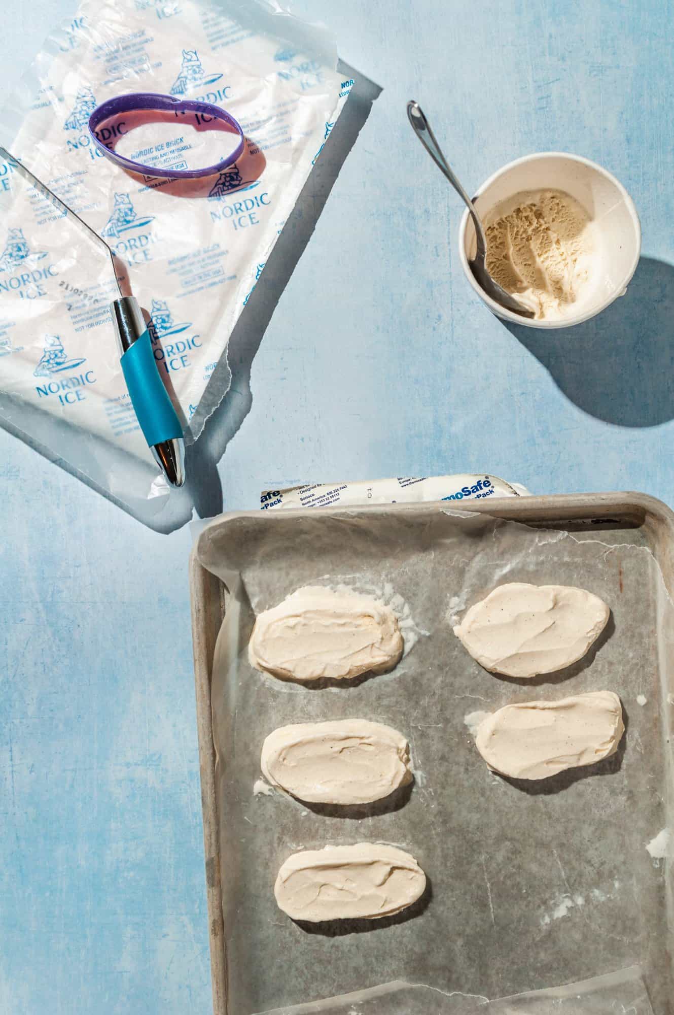 portioning vanilla ice cream into ovals to fill popsicles