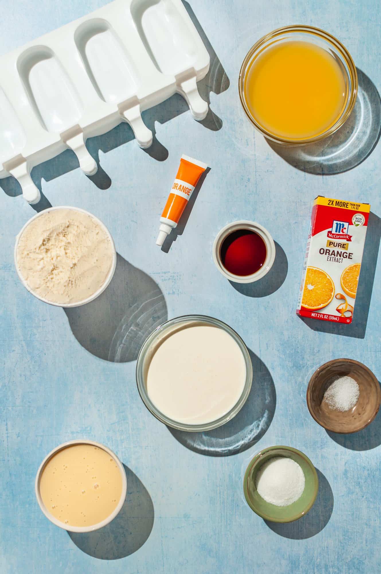 ingredients to make orange creamsicle ice cream popsicles