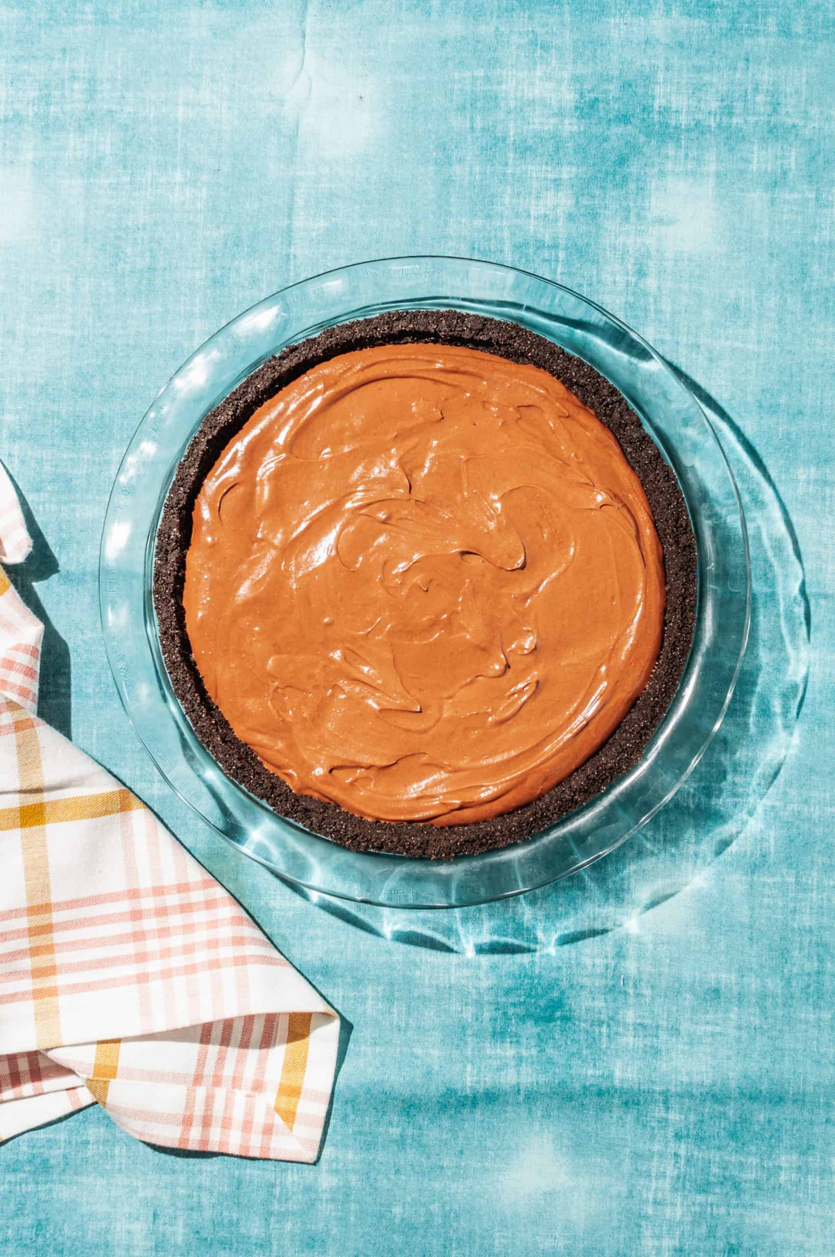 oreo crust filled with chocolate satin mousse filling before it is set