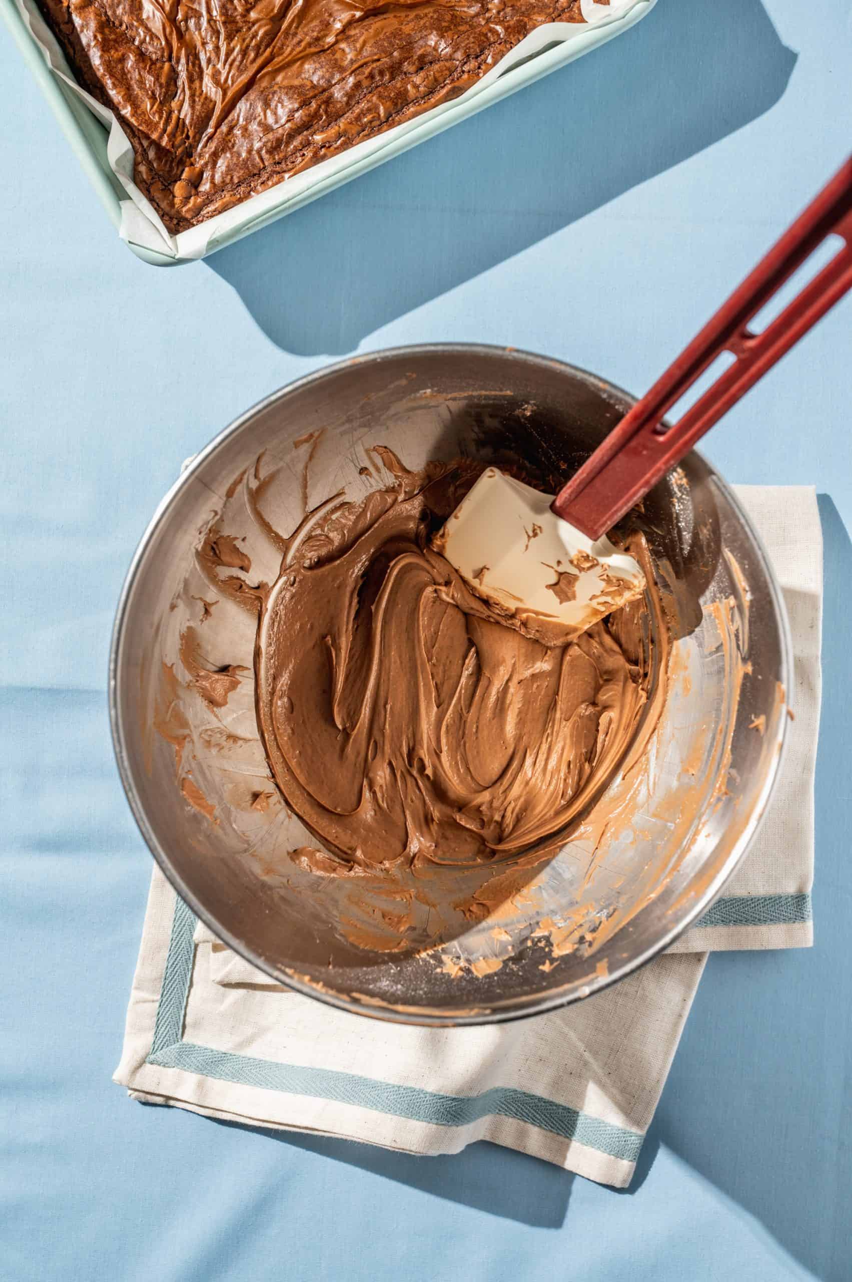 nutella frosting in a mixing bowl with a rubber spatula