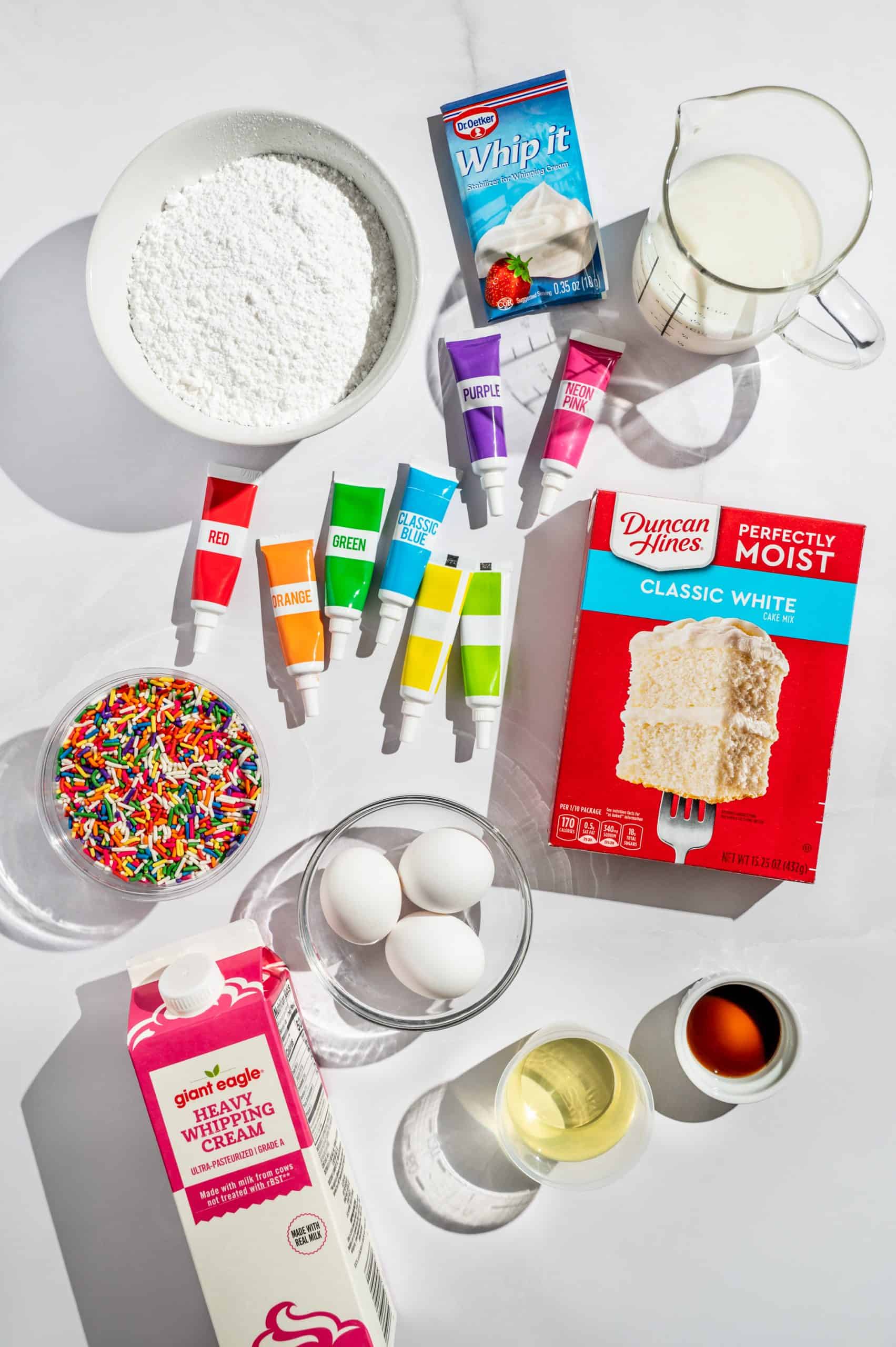 ingredients to make rainbow vanilla ding dongs with boxed white cake mix