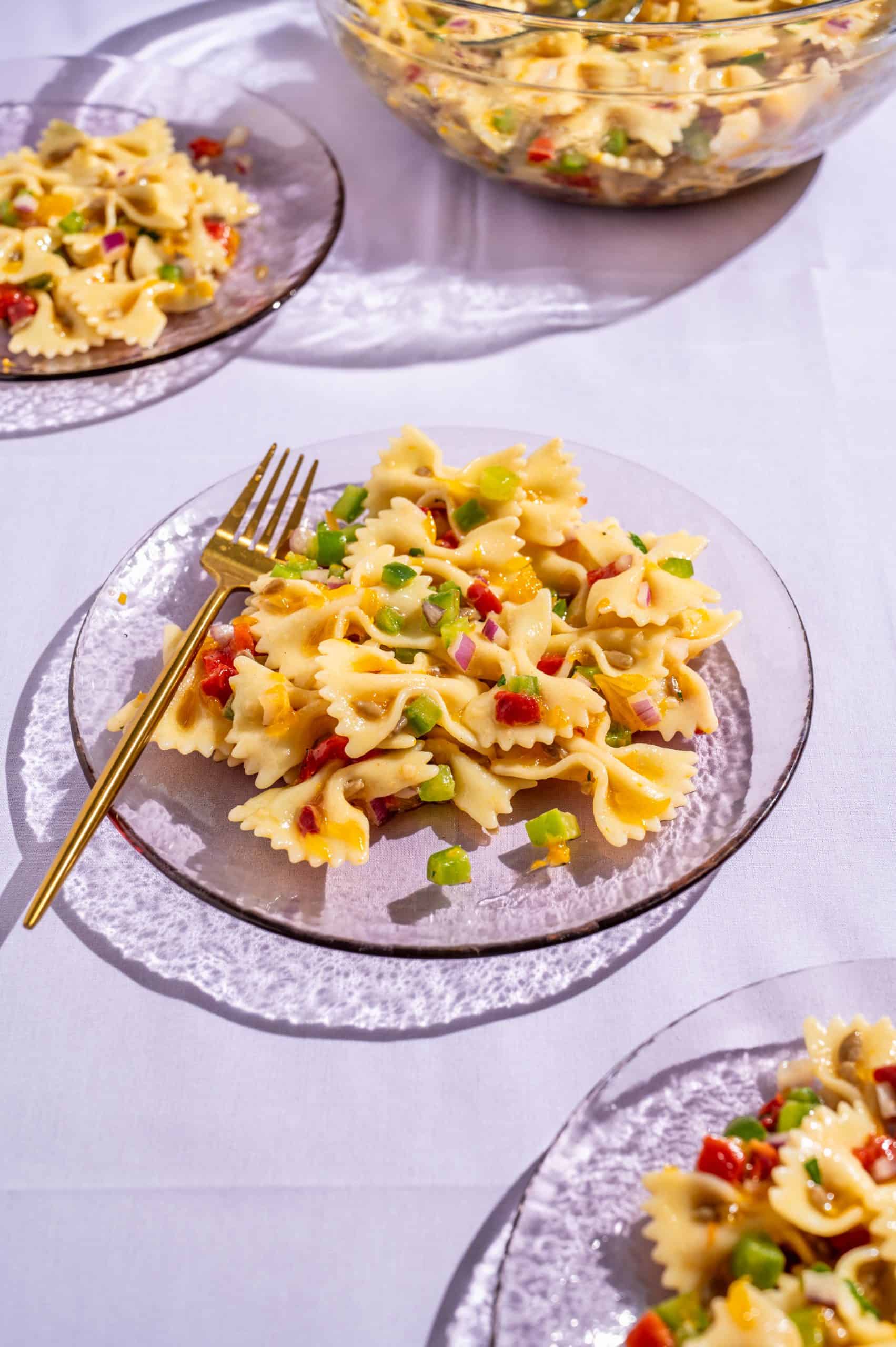 Small serving on honey pasta salad on a glass plate